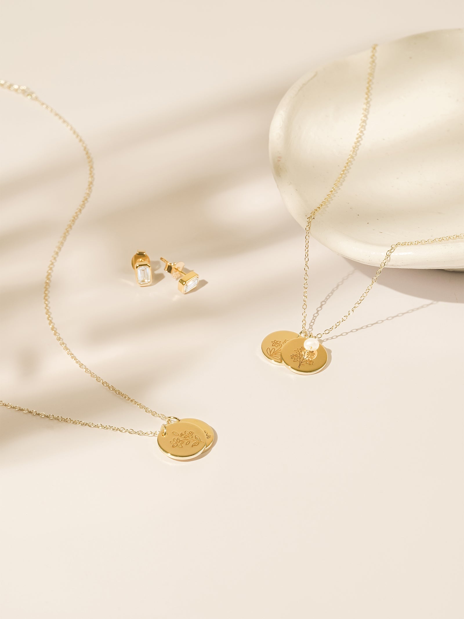 Tender Objects Fleur Layered Necklace - Customizable birthflower charms, pearls, and gold-plated hearts for a chic and personalized look.